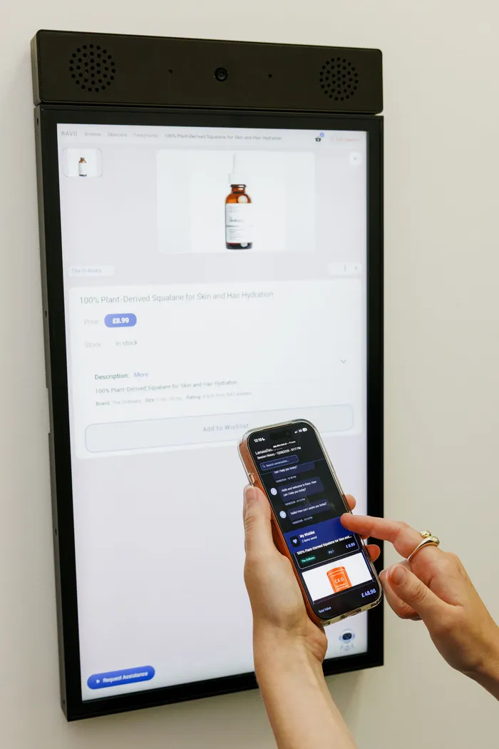 A wall-mounted RAVO kiosk running a skincare catalogue